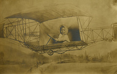 Inflight Infant in an Early Biplane