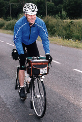 Alan Woods riding in the rain, but still smiling, outbound 2011 PBP