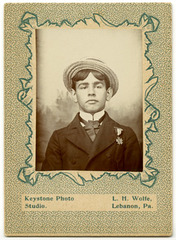 Young Man with Straw Boater Hat and Badge