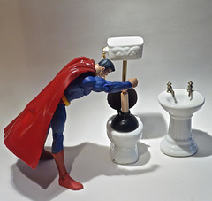Superman Takes Time Out From a Busy Crime Fighting Schedule to Plunge a Toilet He Stopped Up