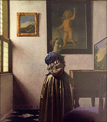 Young Woman standing at a Virginal