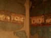 Walls decorated with frescoes.
