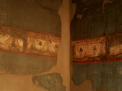 Walls decorated with frescoes.