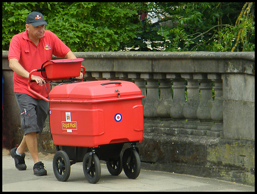Royal Mail postman with trolley