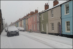 pastel houses in the snow