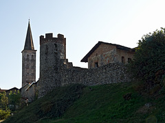 The tower, the walls of Village, and the Romanesque bell tower of the Church Santa Maria (XII century)