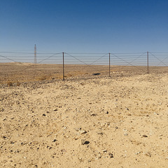 A fence in the desert.