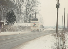 Ambassador Travel MCW Metroliner passing The Manor, at Barton Mills - 9 Feb 1985