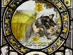 canterbury museum glass   (44)man with boar in cornfield, c16 flemish glass with merchant's mark