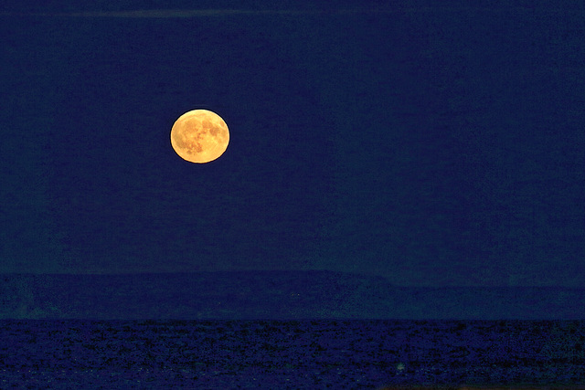 Harvest Moon rising over the Jurassic Coast