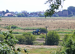 Farm tractor working south of Pevensey Castle 24 7 2013