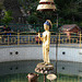 Kathmandu, Swayambhunath, A Bronze Statue of Buddha at the Centre of the Circular Pond