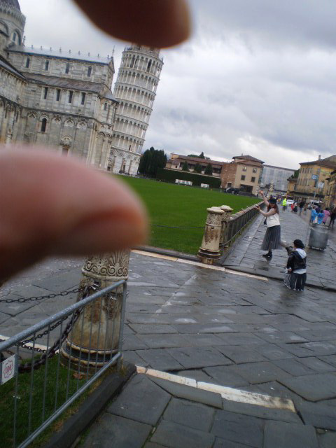 Taking a little souvenir from Pisa.