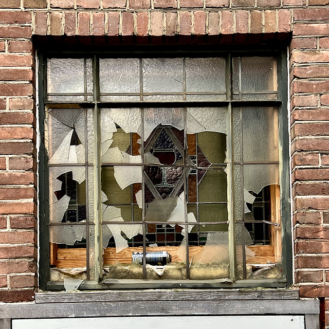 Stained glass behind broken glass