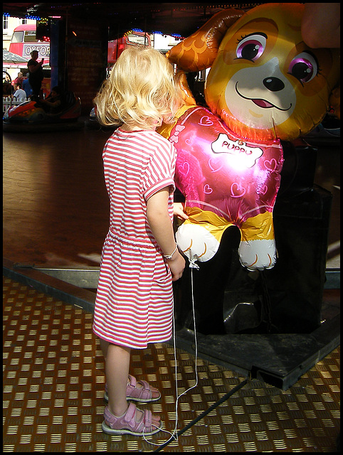 blonde girl with balloon