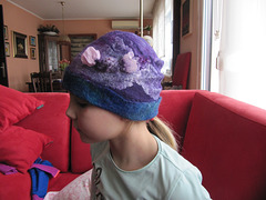kfelted cap with a candy