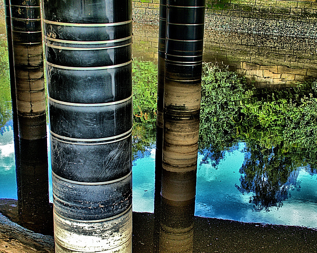 Pillars and Reflections Under The Bridge
