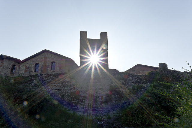 Sun rays from the tower in the medieval village of Candelo Ricetto (BI)