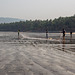 Fishermen on Nandgaon beach preparing their nets