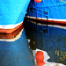Two reflected blue boats