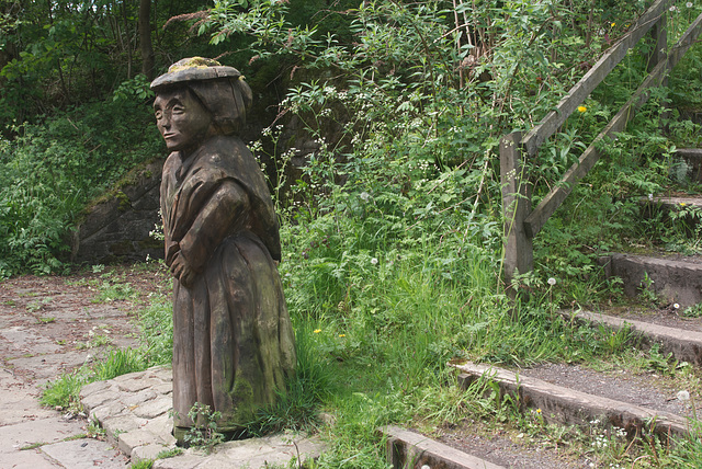 Carved figure at Higher Poynton Station