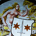 Detail of a Nude Woman Supporting a Heraldic Shield Stained Glass Roundel in the Cloisters, October 2017