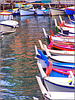 I colori di Camogli riflessi nell'acqua del porto