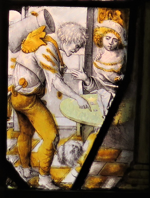 canterbury museum glass   (70)a rather angry looking beggar looks askance at dice on a table in front of a well dressed young woman, c17 flemish glass