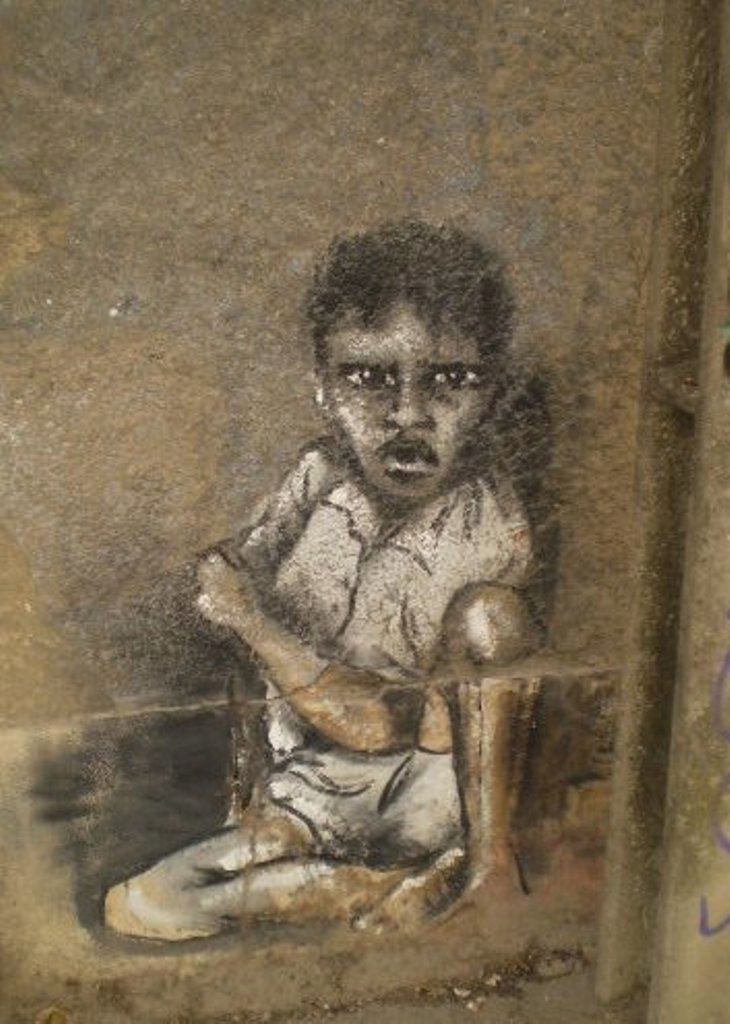 Kid on the wall of abandoned building, by Rosarlette.