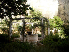 Garden and fountain in the bottom of ancient quarry.