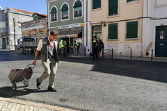 Lisbon 2018 – Postman passing street workers