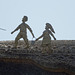 Jack And Jill Sculptures On A Thatched Roof