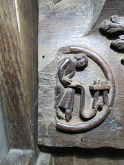 brampton church, hunts (18) c14 misericord man writing on scroll