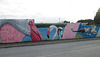Mural of stork and flamingos.