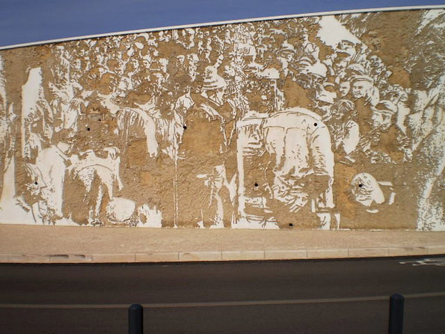 Mural by Vhils - workers of chemical industry.