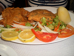 Fried forkbeard fish fillets with potatoes and salad.