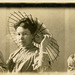 Woman in Five Poses with Hat, Magazine, and Parasol, ca. 1908