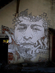 Mural carved by Vhils.