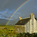 Derelict croft house and rainbow through a rain soaked window, Staffin, Isle of Skye