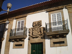 Manor-house with coat of arms.