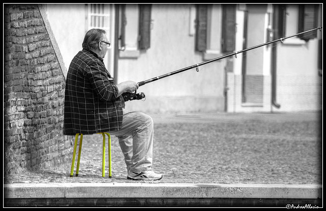 The fisherman on the yellow stool