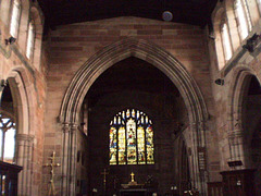 Altar and stained glass windows.