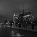 Notre-Dame de Paris Cathedral and the river Seine at night