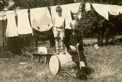 Laundry on the Line, Boy over a Barrel, Dog on a Leash (Cropped)