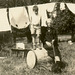 Laundry on the Line, Boy over a Barrel, Dog on a Leash (Cropped)