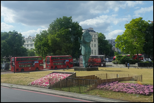 buses round a statue