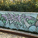 On wall close to the railway.