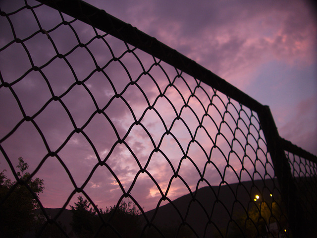 Nightfall through the fence