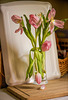Dying Tulips On A Cutting Board In the Kitchen