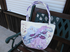 felted bag with sewed on ornaments